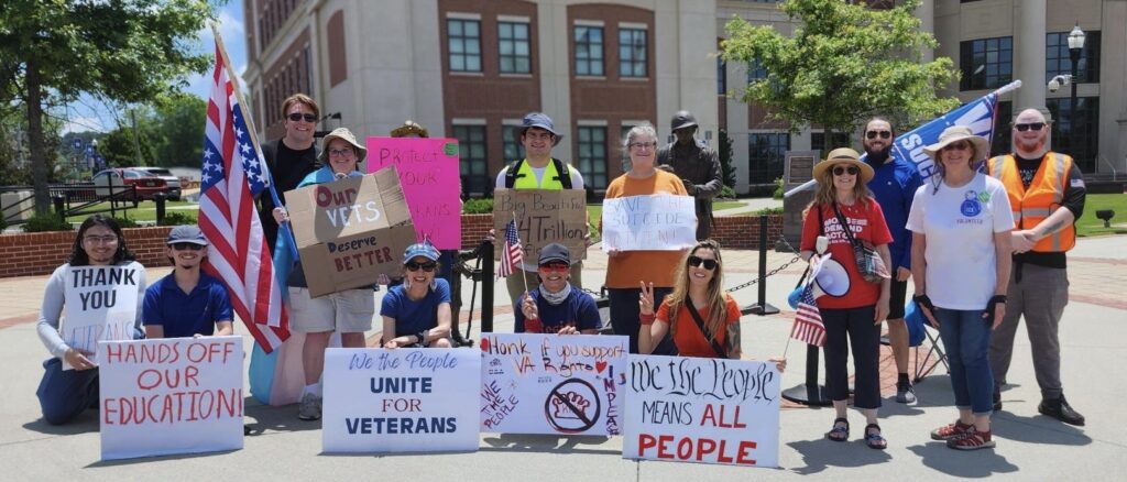 A group of protesters from 50501NorthGA in Cumming, GA on June 13, 2025